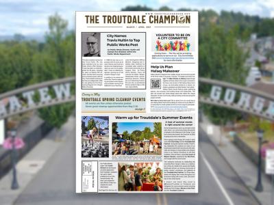 Front page of The Troutdale Champion March-April 2023 edition over a view of downtown Troutdale