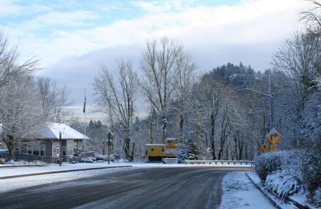 An ice-covered Historic Columbia River Hwy at the edge of Troutdale curves to the right