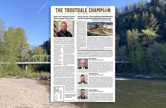 May - June 2023 edition of the Troutdale Champion over a view of the Sandy River at Glenn Otto Park