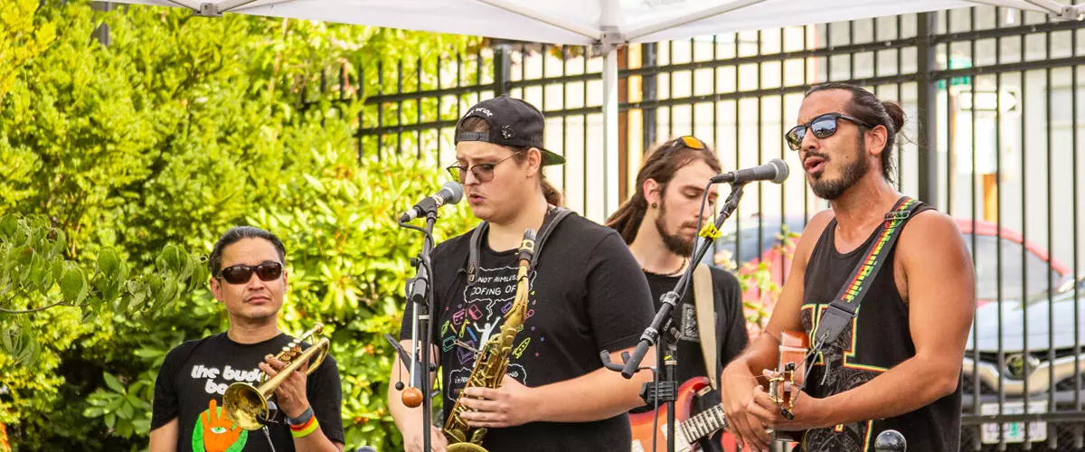 The band CoLoSo performs on the stage at Mayors Square during First Friday