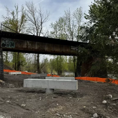 Concrete footers under the rail bridge on the Sandy River Park and Trail