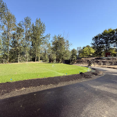 Trail and grassy field in Sharon Nesbit Heritage Park