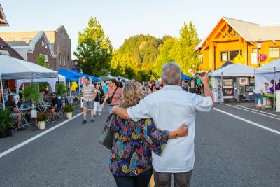a couple looks down Historic Columbia River Highway during First Friday