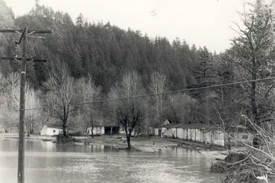 Photo A: The flood of 1964 isolates the Staten Motel, later torn down, in what now is Glenn Otto Community Park. View southeast.