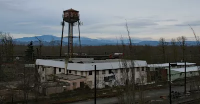 A view of the Confluence site in January 2019. The former wool pullery is in the foreground with the water tower behind it