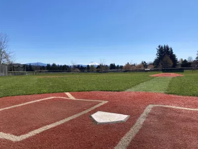 Little League baseball field at Columbia Park. Home plate in the foreground, view of Mt. Hood in the distance.