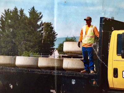 Mick unloads planters from a truck