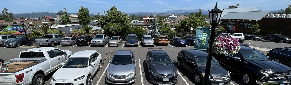 Cars parked in the Mayors Square lot in downtown Troutdale
