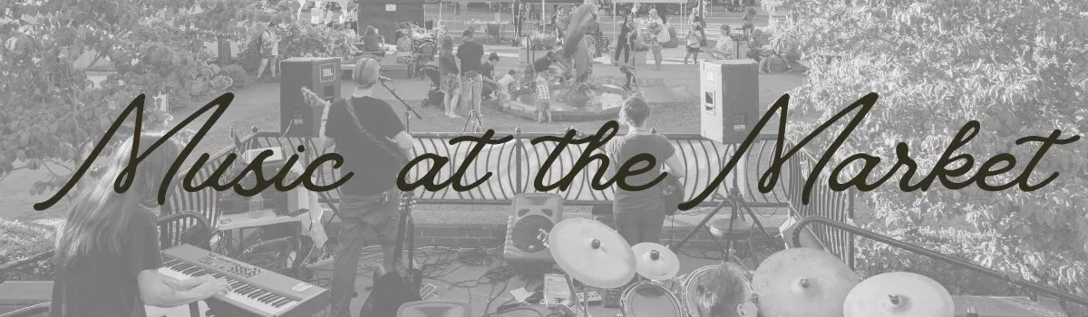 Black and white image of view from behind a band playing at Mayors Square