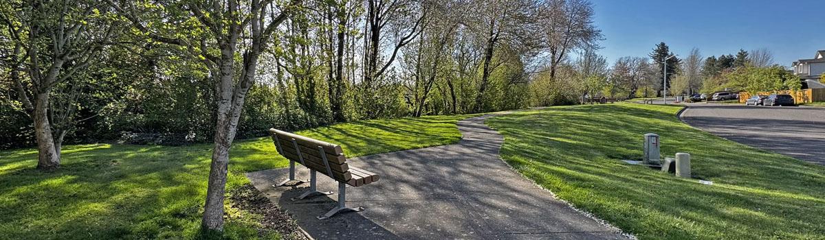 A bench along the walkway at Cannery Park in Troutdale