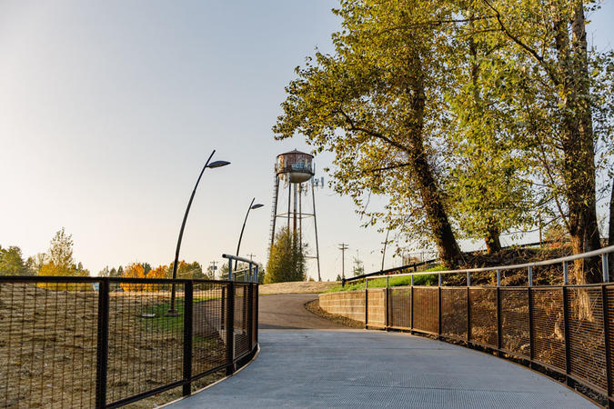 The historic water tower rises over Sharon Nesbit Heritage Park